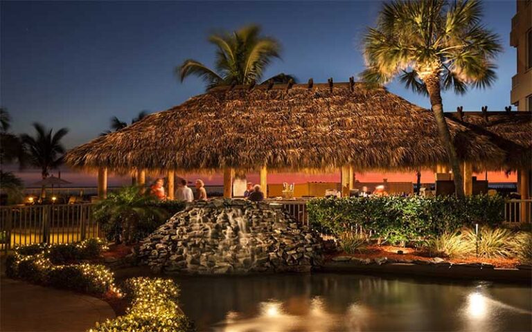 night outdoor tiki hut near pool at lido beach resort sarasota