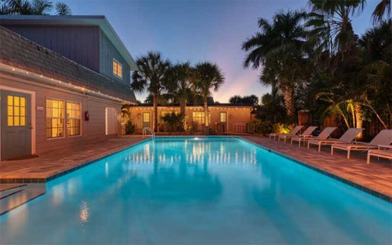 night view of lit up pool and villas at cottages at siesta key sarasota