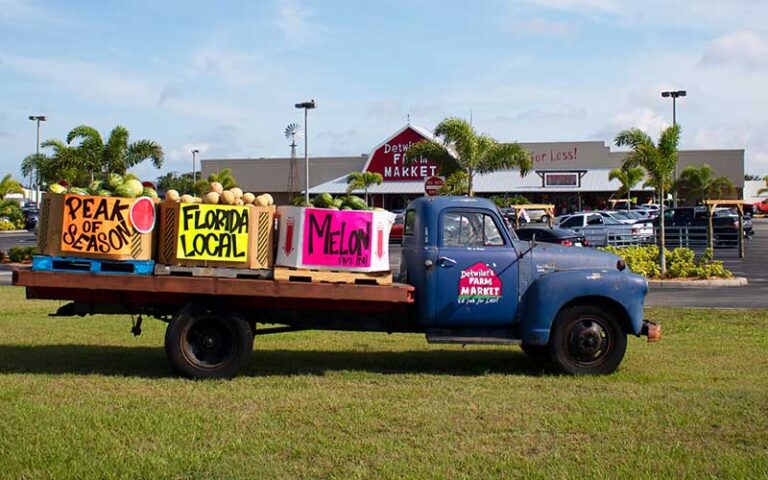 old produce truck with fruits parked in front of store at detwilers farm market sarasota
