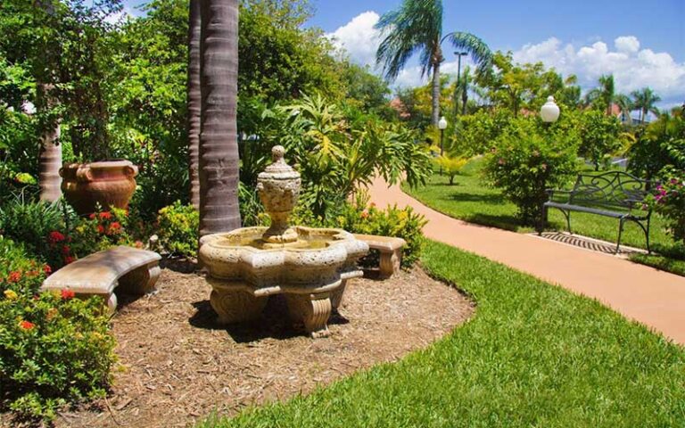 outdoor walkway with fountain at best western plus siesta key gateway sarasota