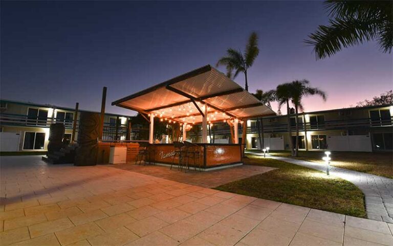 patio area near pool with outdoor bar at golden host resort sarasota