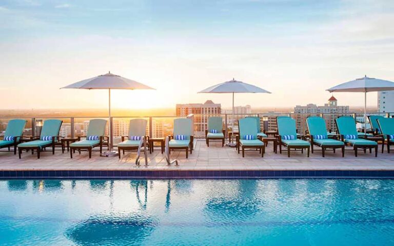 rooftop pool with sun umbrellas and chairs at westin sarasota