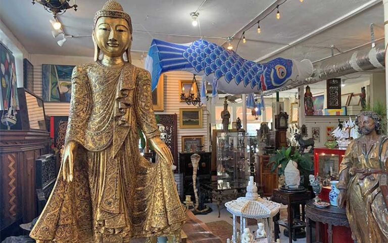 sales floor of antiques with hindu statue at sarasota trading company
