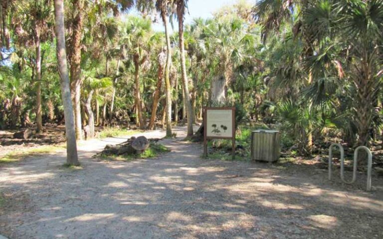 signs and bike rack near entrance at myakka canopy walkway sarasota