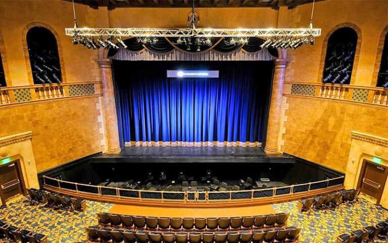 stage with blue curtain gold walls and pit at sarasota opera house