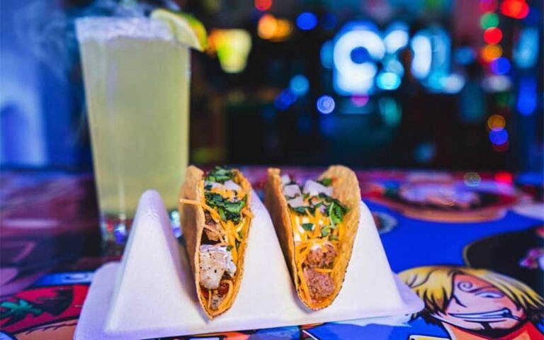 tacos with margarita on colorful painted bar at arcade monsters lido beach sarasota