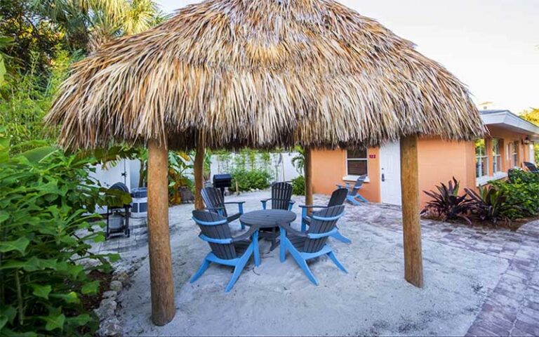 thatched hut over patio table and chairs at siesta key beachside villas sarasota