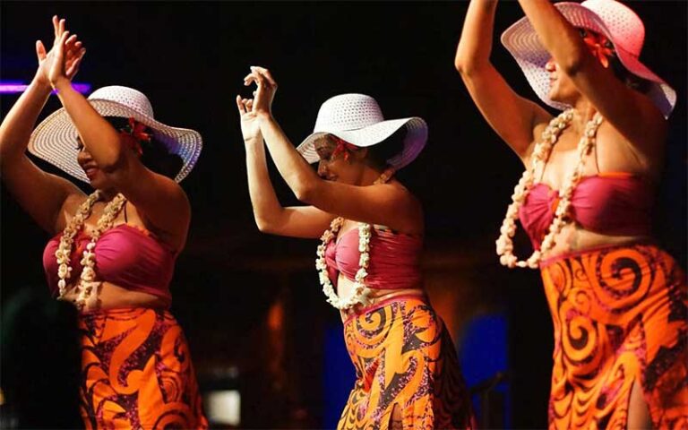 three female dancers on stage at polynesian fire luau orlando