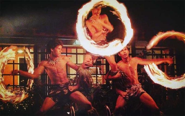 three polynesian fire dancers making circles on stage at polynesian fire luau orlando