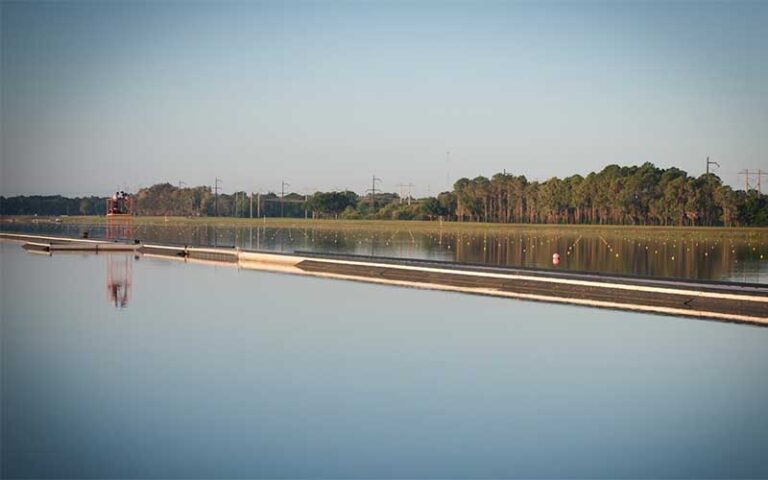 water with race markers and clear sky reflected at nathan benderson park sarasota