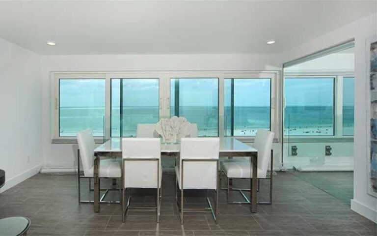 white dining room with beach view at horizons west condo rentals sarasota