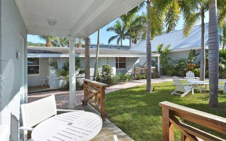 yard area with patios villas and trees at cottages at siesta key sarasota