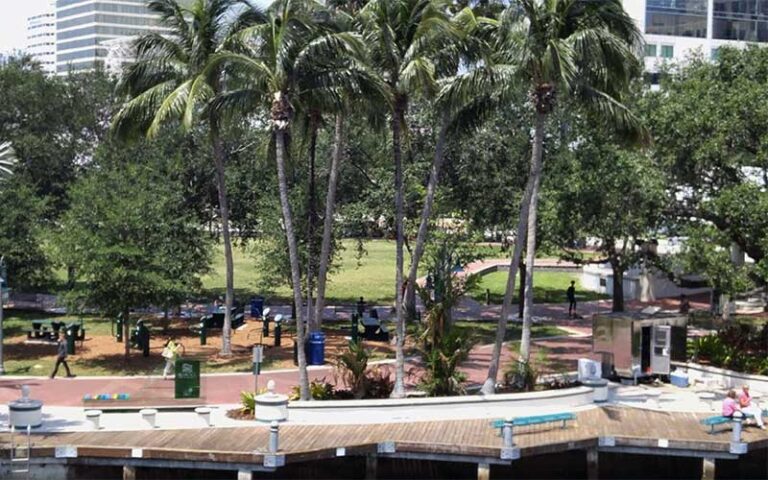 river front park area with benches walkway and palms at riverwalk fort lauderdale