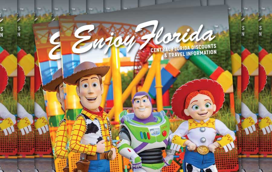 stacks of magazines with cowboy spaceman and cowgirl costumed characters at disney for enjoy florida magazine cover