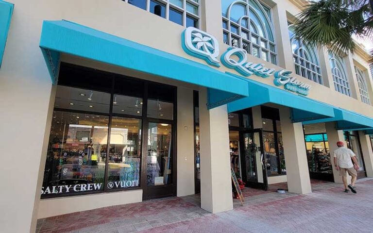 storefront with man on sidewalk and sign quiet storm shop at riverwalk fort lauderdale