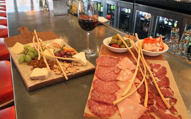 bar top charcuterie spread with red wine at louis bossi ristorante bar pizzeria ft lauderdale