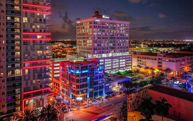 night view of lit up buildings downtown at rooftop 1wlo ft lauderdale