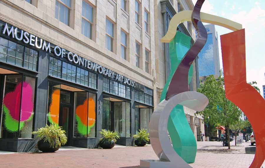 street front entrance with abstract colorful sculpture at museum of contemporary art jacksonville