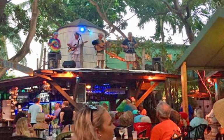 backyard dining area with water tower stage band playing at blue heaven key west