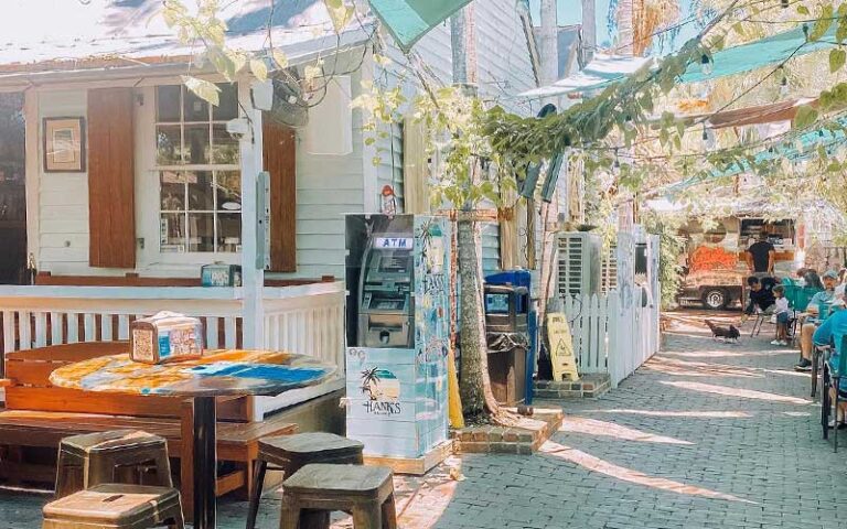 brick alley behind bar with food stand at garbos grill key west