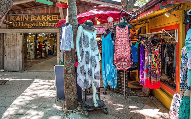 clothing shop with sign for pottery store on outside walkway at rain barrel village islamorada florida keys