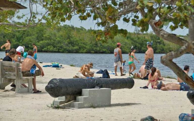 crowded beach area with historic cannon at john pennekamp coral reef state park key largo