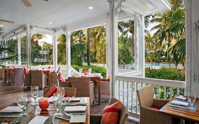 dining veranda with tropical theme and pool view at butterfly cafe marathon fl keys