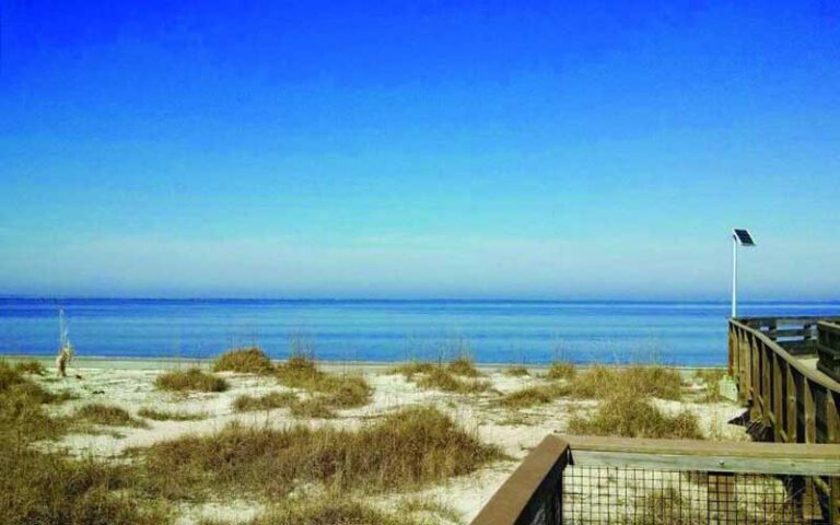 dunes and boardwalk on beach at fort clinch state park jacksonville