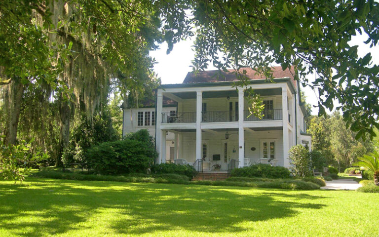 historic colonial style home in garden area with trees at harry p leu gardens orlando