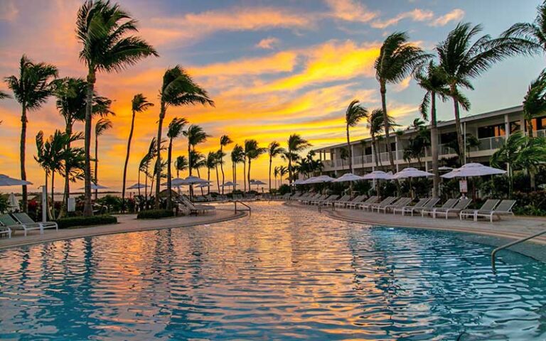 hotel building with pool and sunset at hawks cay resort fl keys