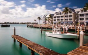 hotel on blue water with boats at dock at opal key resort marina key west