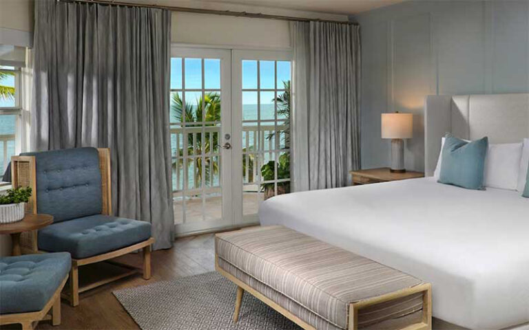 king bed room with ocean view at southernmost beach resort key west