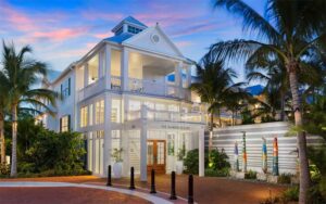 night front exterior lighted hotel with palms at the marker key west harbor resort