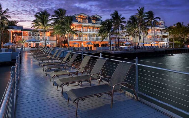 night view from dock of beachfront lit up resort at southernmost beach resort key west