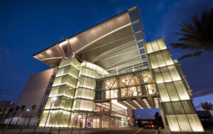 nighttime exterior of theater building with dramatic lighting at dr phillips center for the performing arts orlando