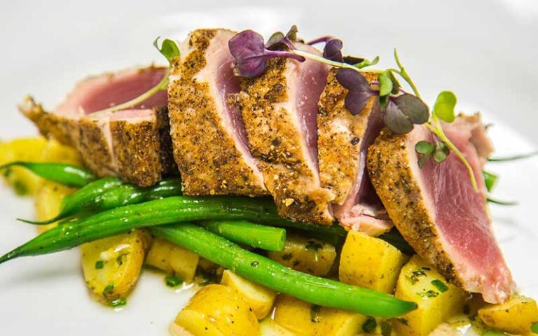 seared encrusted fish with tropical garnish at cafe marquesa key west