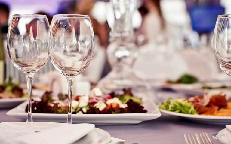 table set with salads and wine glasses at chef michaels islamorada fl keys