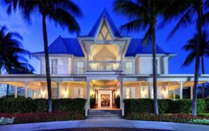 twilight front exterior with palms at butterfly cafe marathon fl keys