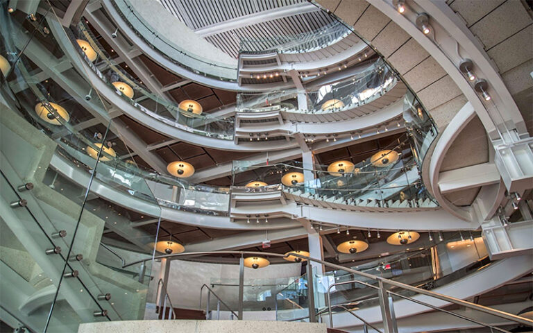 upward view of atrium with multi story stairs and lighting at dr phillips center for the performing arts orlando