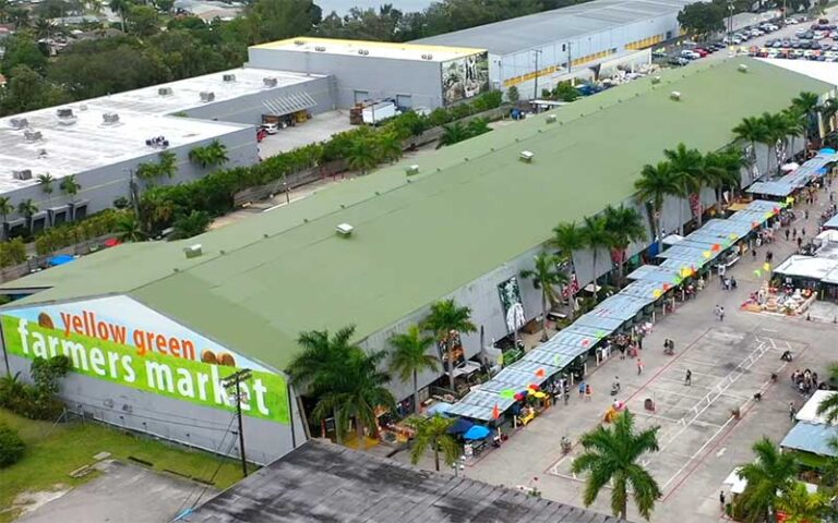 aerial of building with stalls and parking at yellow green farmers market hollywood fl