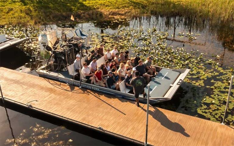 aerial view of large airboat with riders at dock at sawgrass recreation park everglades