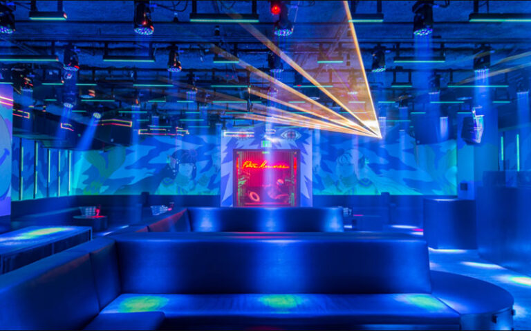 blue lighting lounge area in club at basement bowl and skate miami beach edition