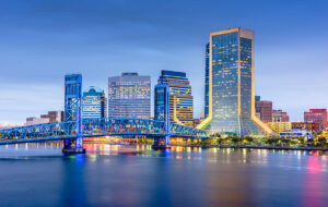 blue lit long exposure of downtown skyline bridge over st johns river jacksonville