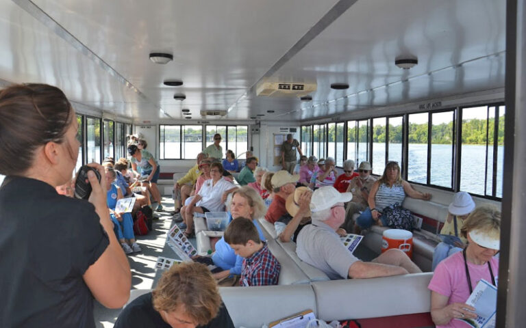 boat interior with cruise guide speaking on intercom at st johns river taxi jacksonville