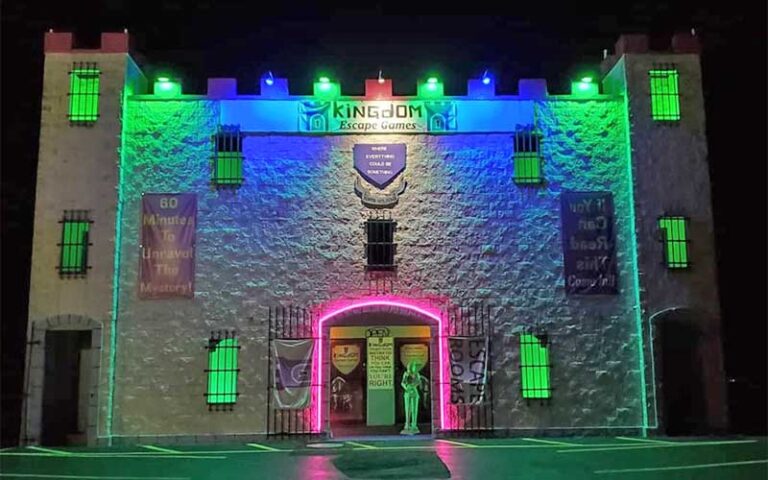 castle themed building at night with neon at kingdom escape games key largo