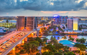 colorful night skyline of downtown fort lauderdale with drawbridges up and cloudy evening