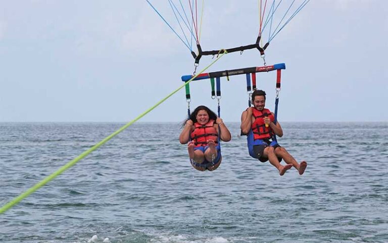 couple laughing while being towed at z flight parasail watersports marathon fl keys