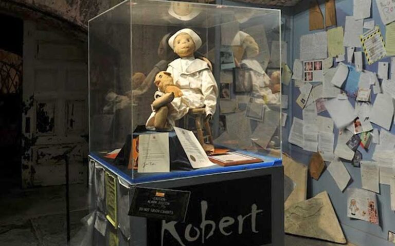 creepy sailor doll in glass case at ghosts and gravestones tour key west