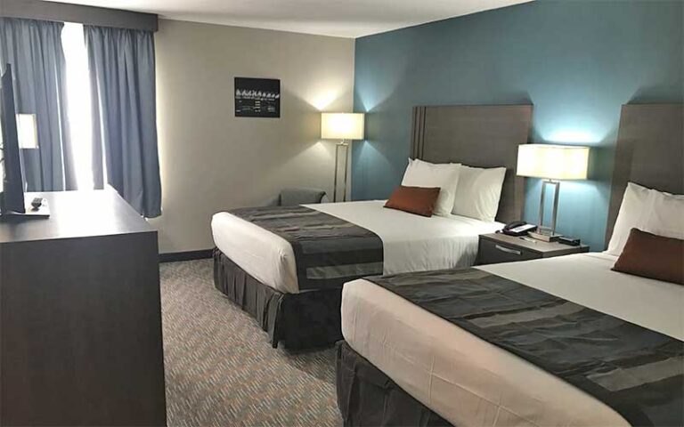 double room with blue accents at grand hotel kissimmee