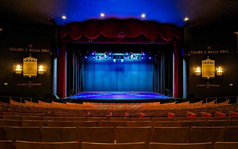 empty stage from back with red seats and blue lighting at the parker fort lauderdale